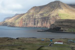 Landscape picture of Faroe Island, a fjord and mountain and house, photo taken by Erik Christensen, Porkeri/norden.org