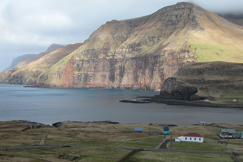 Landscape picture of Faroe Island, a fjord and mountain and house, photo taken by Erik Christensen, Porkeri/norden.org
