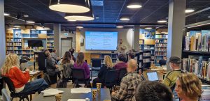 arcsolution researchers and locals together in library in longyearbyen