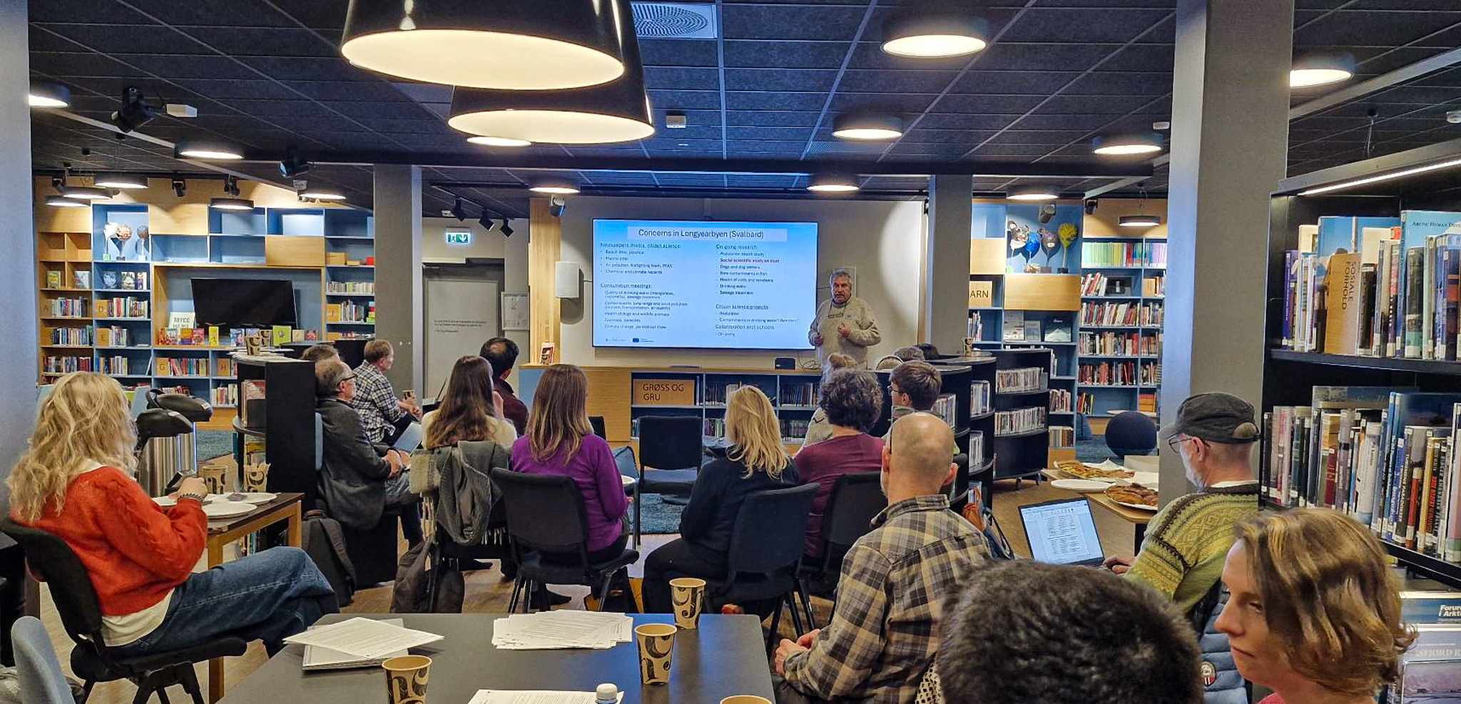 arcsolution researchers and locals together in library in longyearbyen